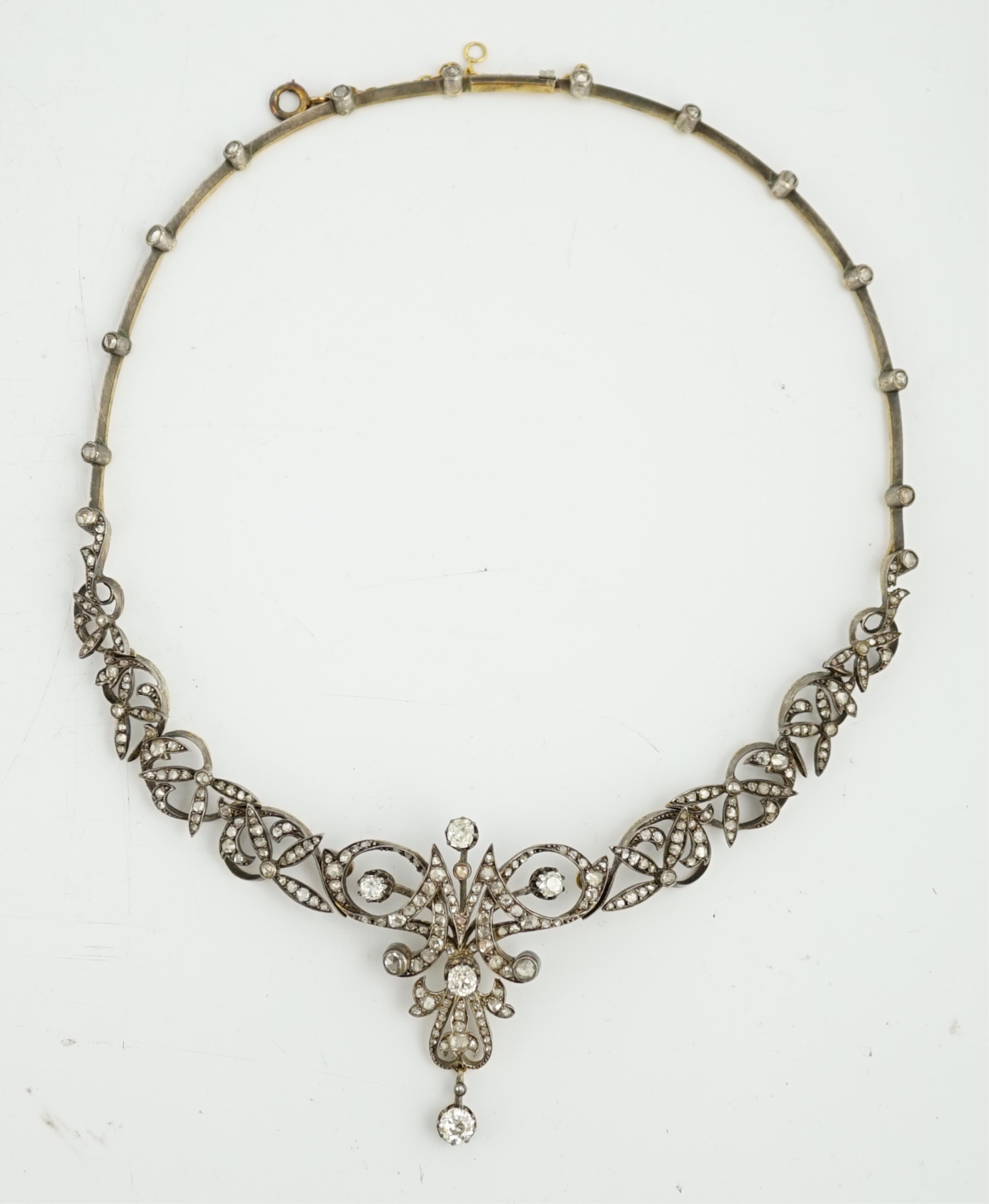 A late 19th/early 20th century French 18ct gold and silver, old mine and rose cut diamond cluster set tiara/necklace